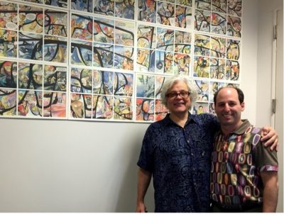 Image features Michael Nicoll Yuhgulanaas and AMNH Associate Director of Digital Learning, Barry Joseph, in front of a printout of Red.